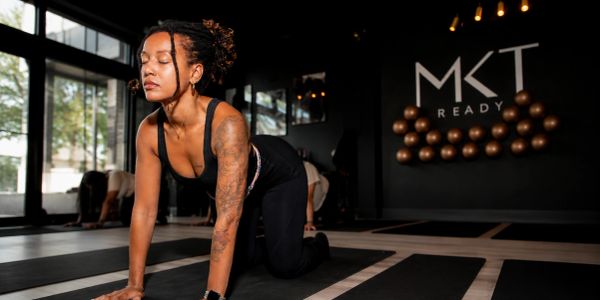 Woman doing yoga pose indoors.