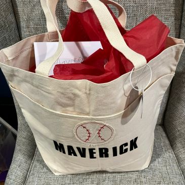 Canvas tote bag with 'Maverick' and baseball graphic.