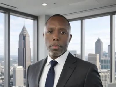 Professional man in a suit with city skyline background.