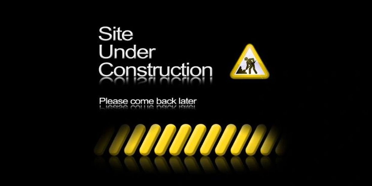 Website under construction with a progress bar and caution sign.