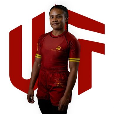 Athletic woman in red sportswear posing confidently with WOTF logo background.