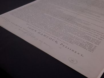 Close-up of a historical document signed by John Hancock.