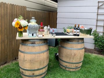 Whiskey barrel mobile bar setup