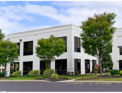 An image of Thrift Financial office building.   A two-story white office building. 