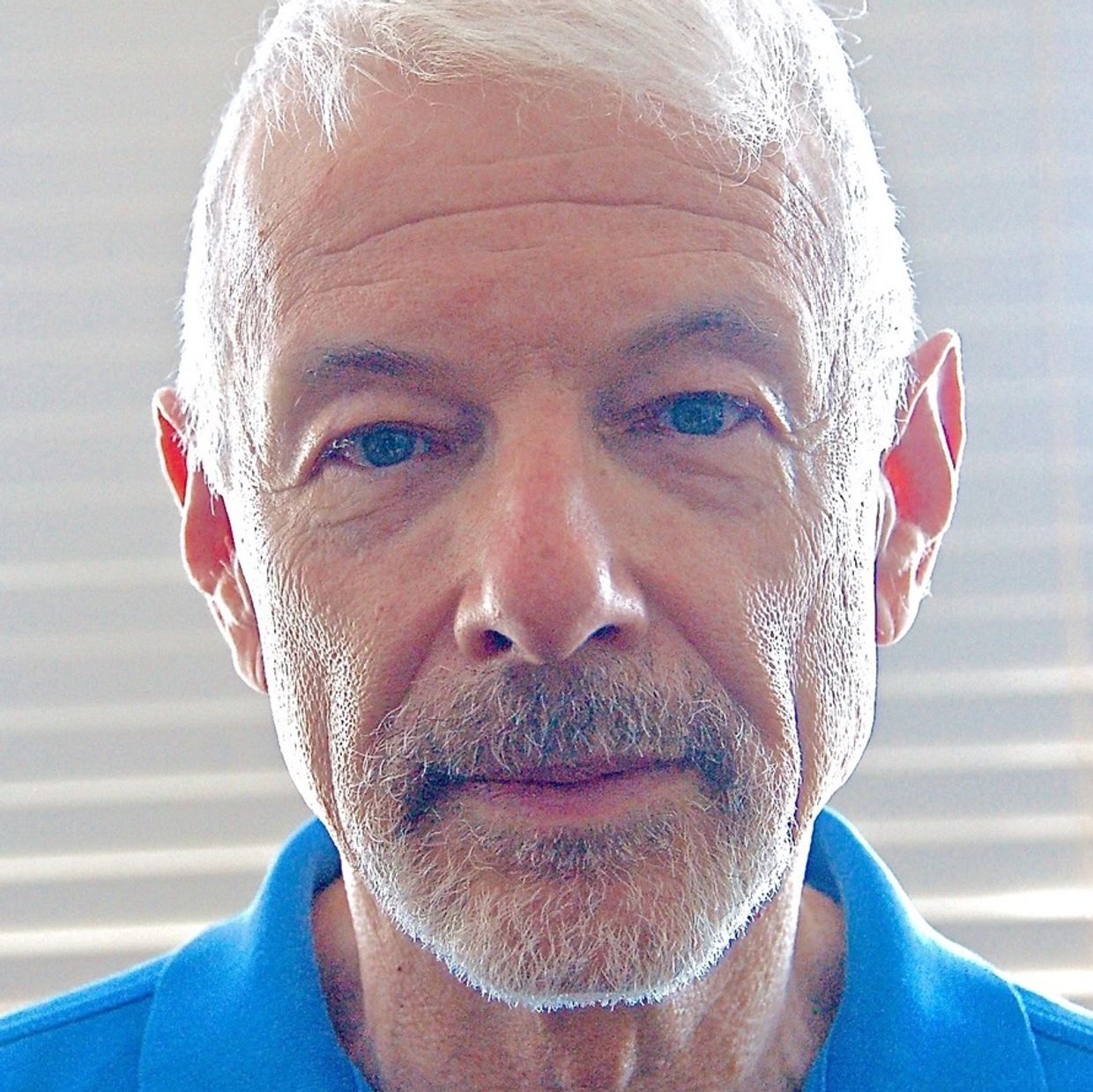 Close face photo of author Perry Brass.