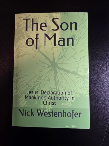 Book titled 'The Son of Man' by Nick Westenhofer on a dark surface.