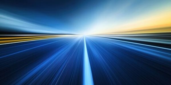 A long exposure photo of the road at dusk.
