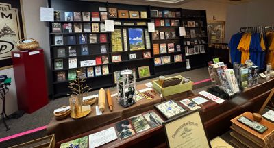 A store display with books, postcards, and souvenirs.