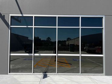 Daytime privacy window tinting with a sleek mirrored finish for heat and glare control.