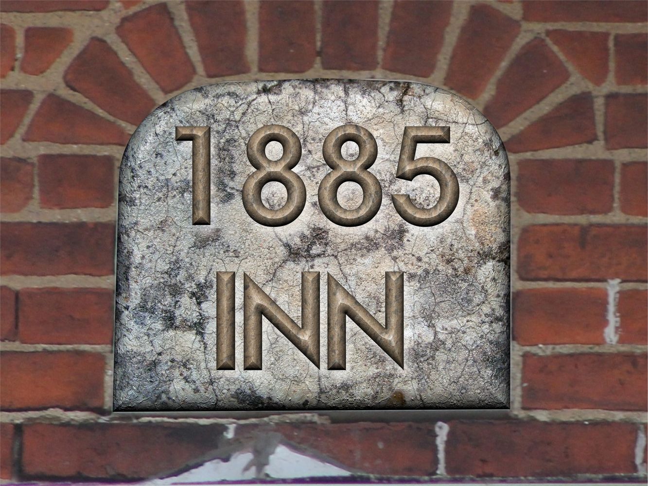 Keystone at peak of house toward the road is marked 1885.