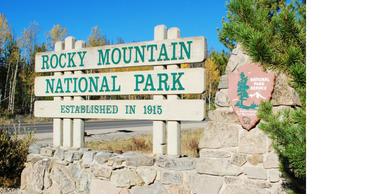 Entrance sign for Rocky Mountain National Park established in 1915.