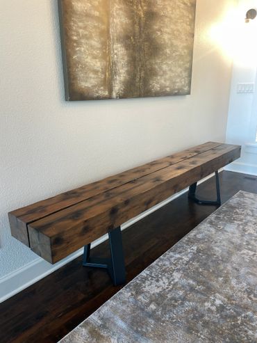 Rustic beam bench sitting on hardwood floors