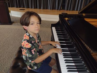 Man composing music on piano