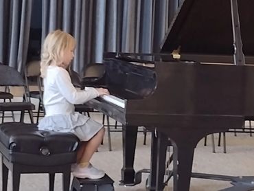 Child practicing piano