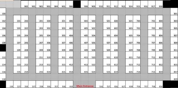 Floor plan of a building with room numbers and a main entrance.