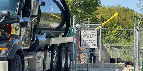 Wilson & Son Pumping truck servicing the City of Van, Texas lift station with commercial pumping maintenance.