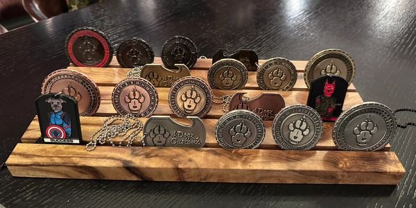 RPG Challenge Coins on a wood challenge coin display.