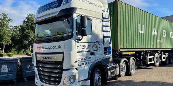 A Freightways truck in a delivery yard ready to deliver a container load to a customer.