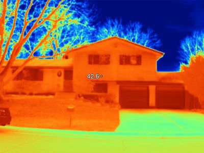 Thermal image showing heat distribution on a house and surrounding area. energy efficiency inspection
home energy audit
infrared camera inspection