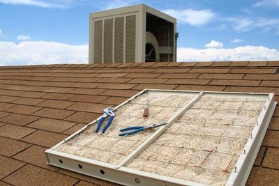 A dirty air filter and tools on a rooftop near an air conditioning unit. evaporative cooler maintenance
seasonal shutdown services
swamp cooler repair