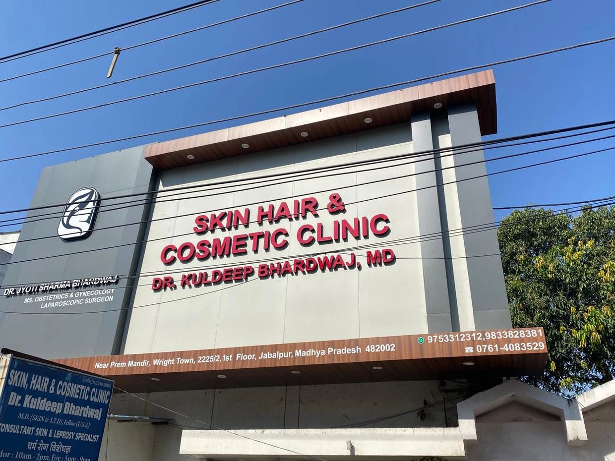 Clinic building signboard for Skin, Hair &amp; Cosmetic Clinic by Dr. Kuldeep Bhardwaj in Jabalpur.