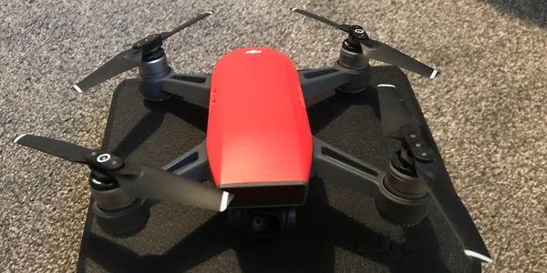 Red and Black Drone that take pictures