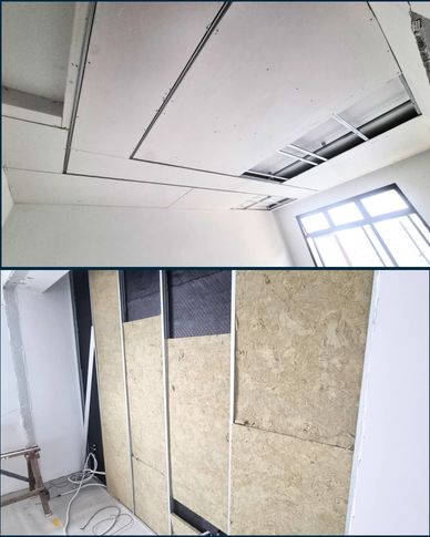 Interior construction work on ceiling and wall insulation.