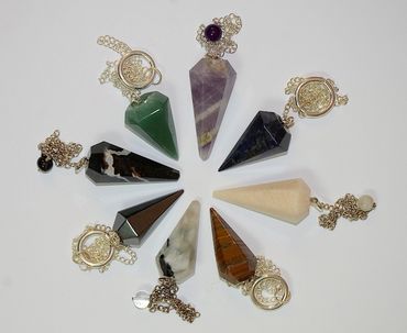 Pendulums made from Amethyst, Aventurine, Rose Quartz, Hematite, Rainbow Moonstone, and others.