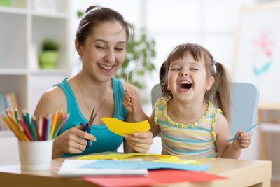 child with autism learning from RBT at home during ABA therapy session