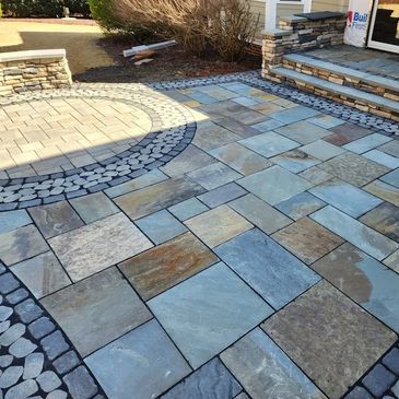 Stone Patio with Paver integration and stone seating wall in Wake Forest, NC