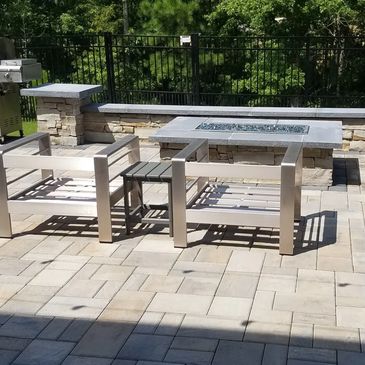 Paver Patio with Stone seat walls and a gas fire pit.