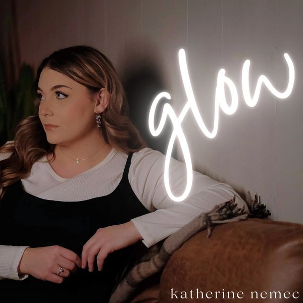 Woman with soft lighting and 'glow' text.