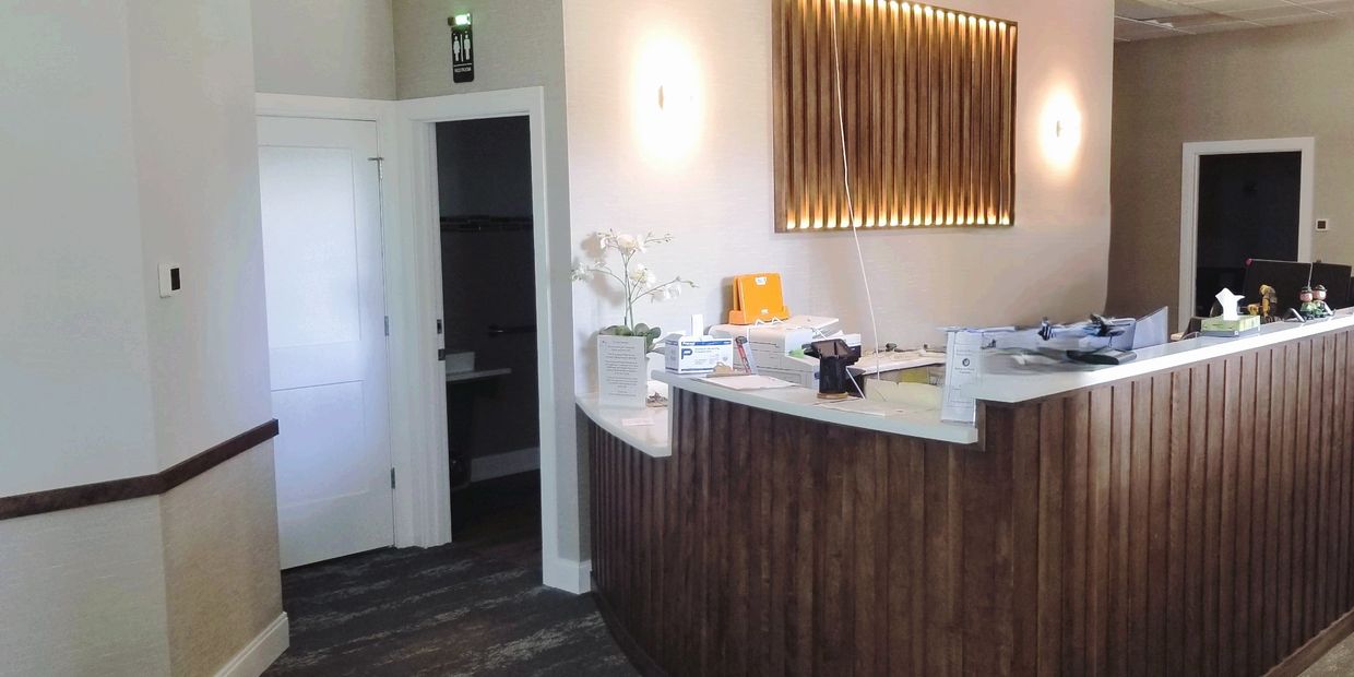 reception desk, custom wall sconce and lighting, ADA compliant bathroom, office renovation