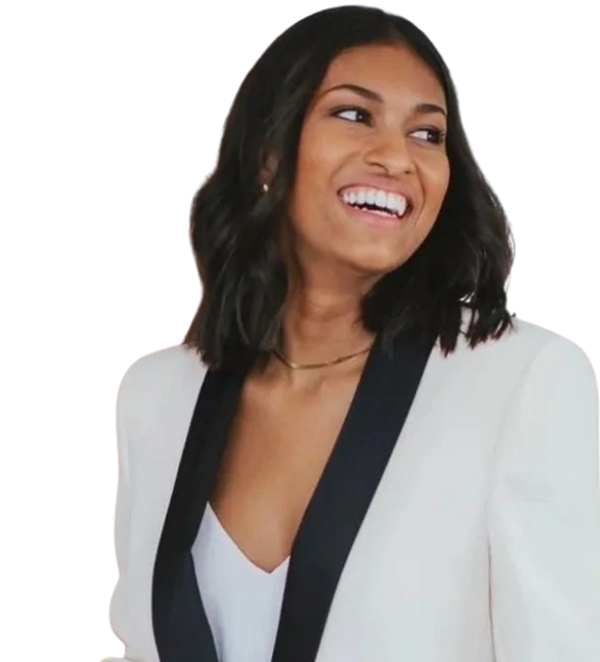 Smiling woman in a white blazer with black lapels.