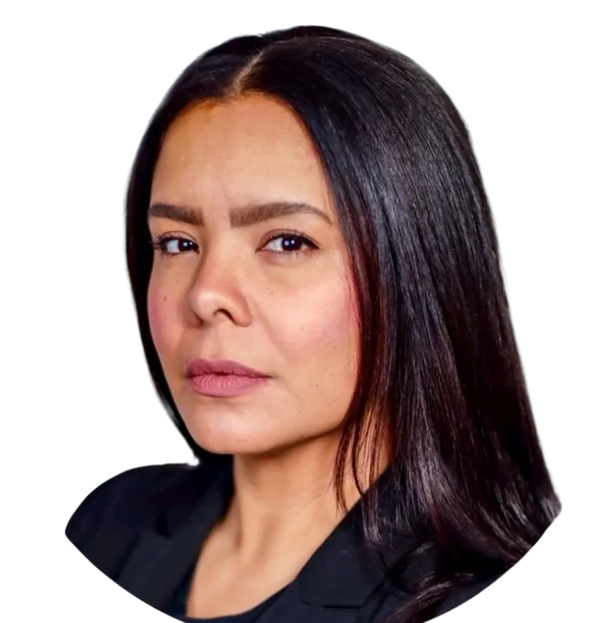 Serious woman with long dark hair and a focused expression.