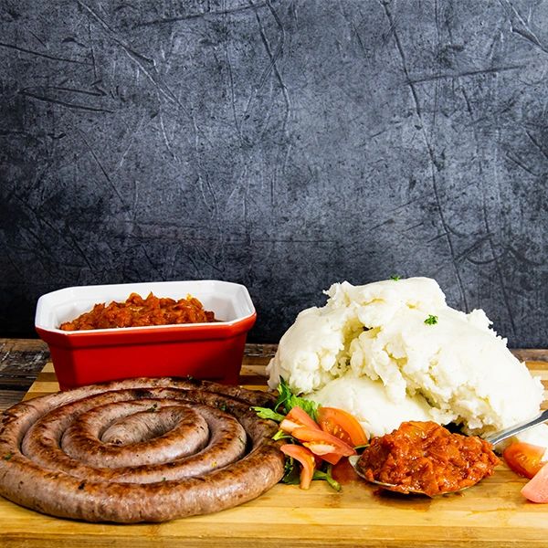 Boerewors with pap the white stuff and chutney from tomato.