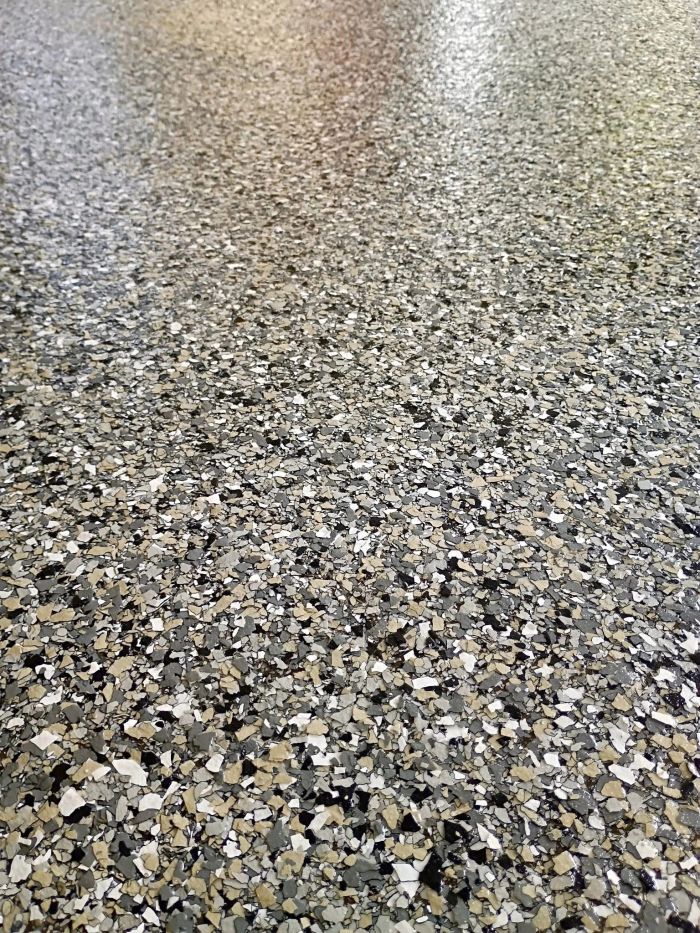 Close view of a flake-finish floor catching the light