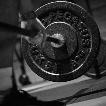 Lifting a Barbell and Weights Gym Tiverton