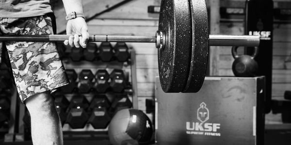 Lifting weights in the Gym Tiverton