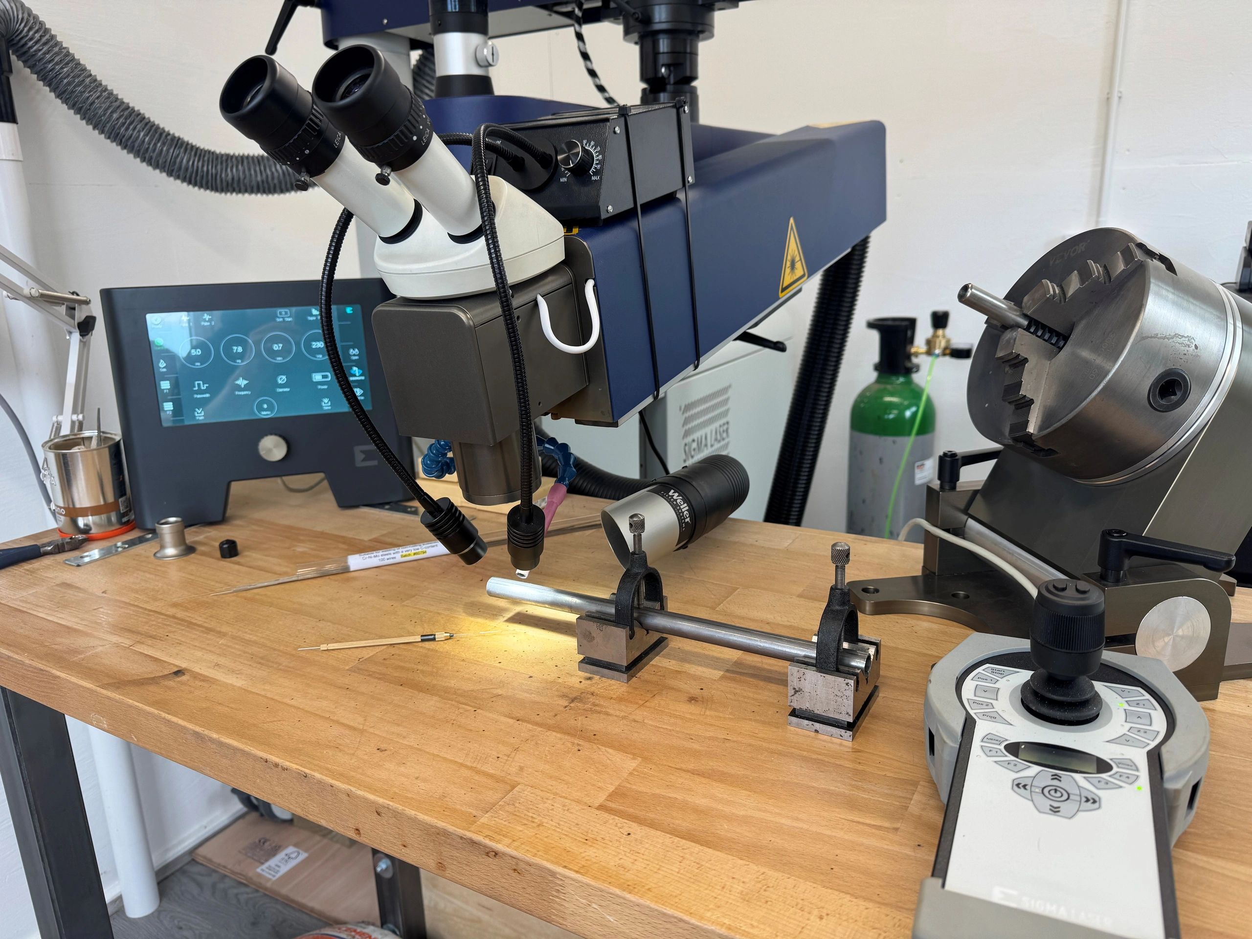 Scientific laboratory setup with microscope and precision instruments.