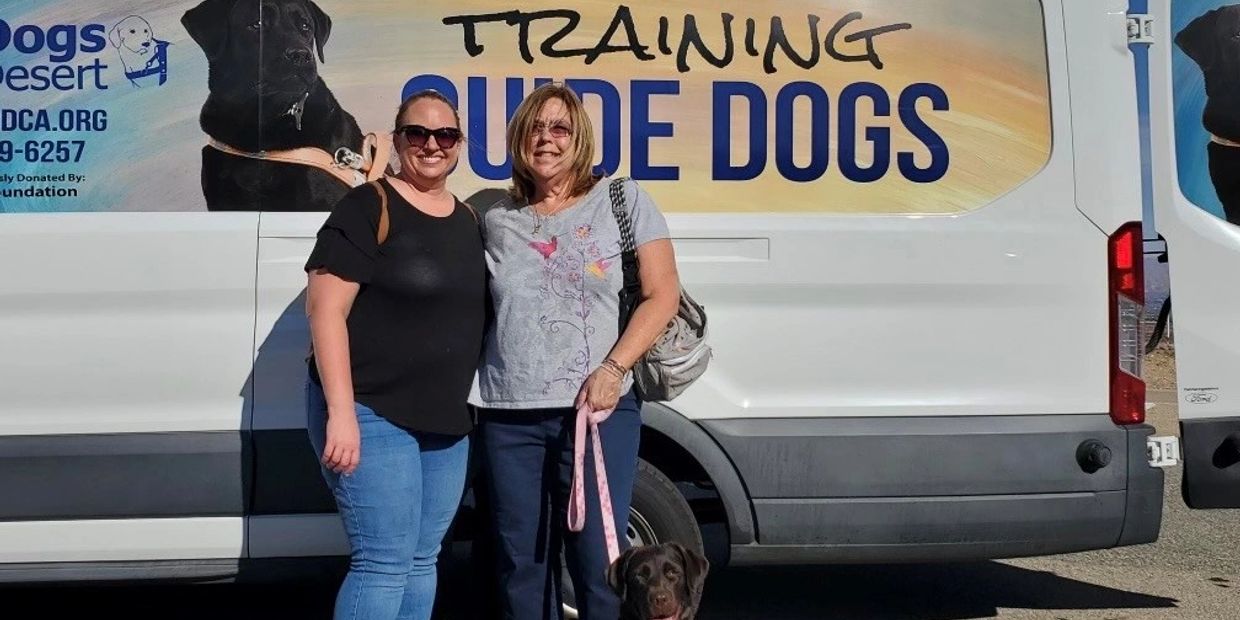 Kathy Z, her daughter Kris, and Guide Dog In Training, Loki