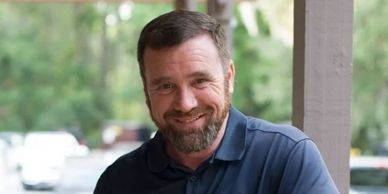 man with beard smiling