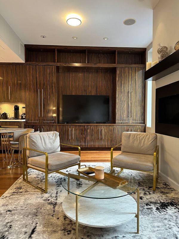 living room with two chairs in penthouse