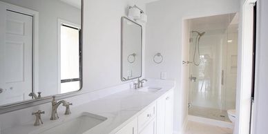 Coastal white marble bathroom renovation in Wilmington by NC Hammer Construction.
