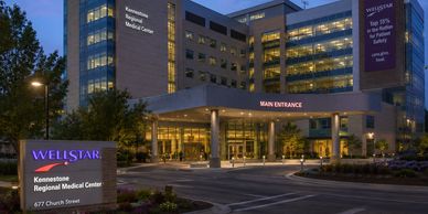 Wellstar Kennestone Regional Medical Center entrance at dusk.