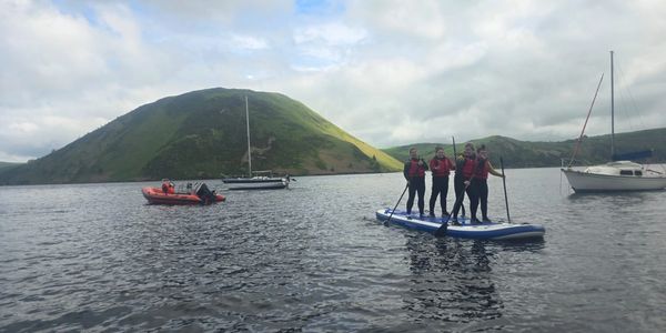 Group paddleboarding lesson. Enjoying the mega SUP.