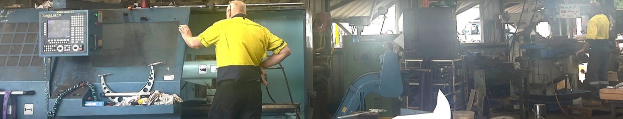 Jenner Engineering team operating precision machines – defence-ready precision – Mackay Queensland j