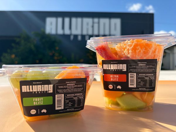Two containers of Alluring Fruits fruit salads labeled Fruit Blitz and Ultra Blitz.