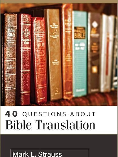 A collection of various Bible editions with a book title on Bible translation.