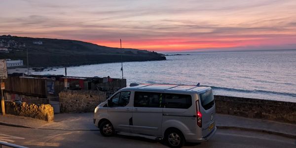 taxi company st ives taxi at sunset